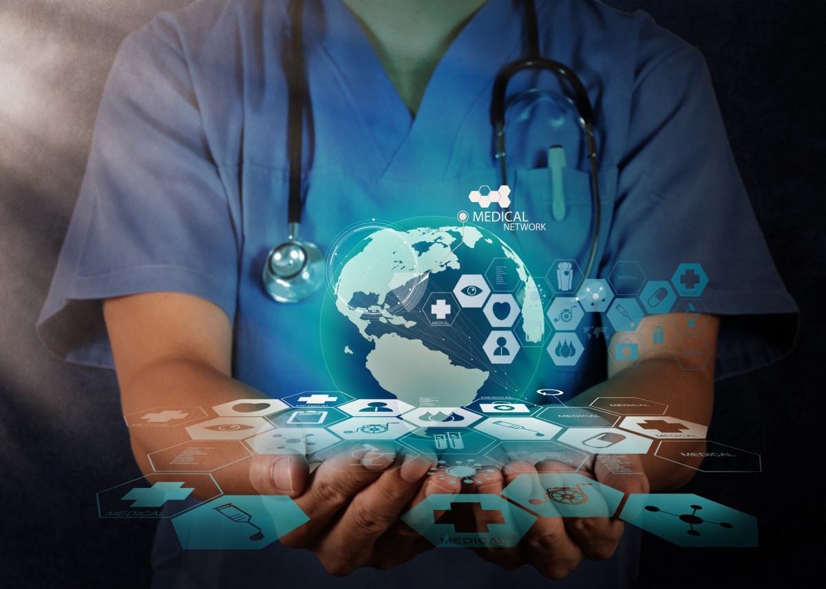 Medical Doctor holding a world globe in her hands as medical network concept