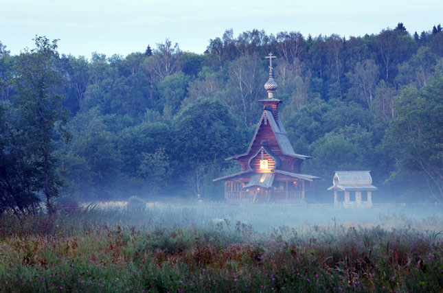 Small wooden orthodox church in the twilight